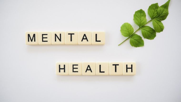 Photo of tiles arranged to say 'mental health'