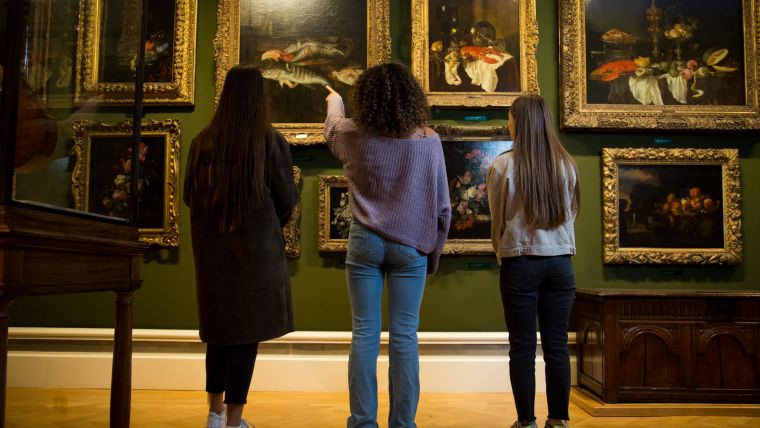 Some young people looking at art in a museum